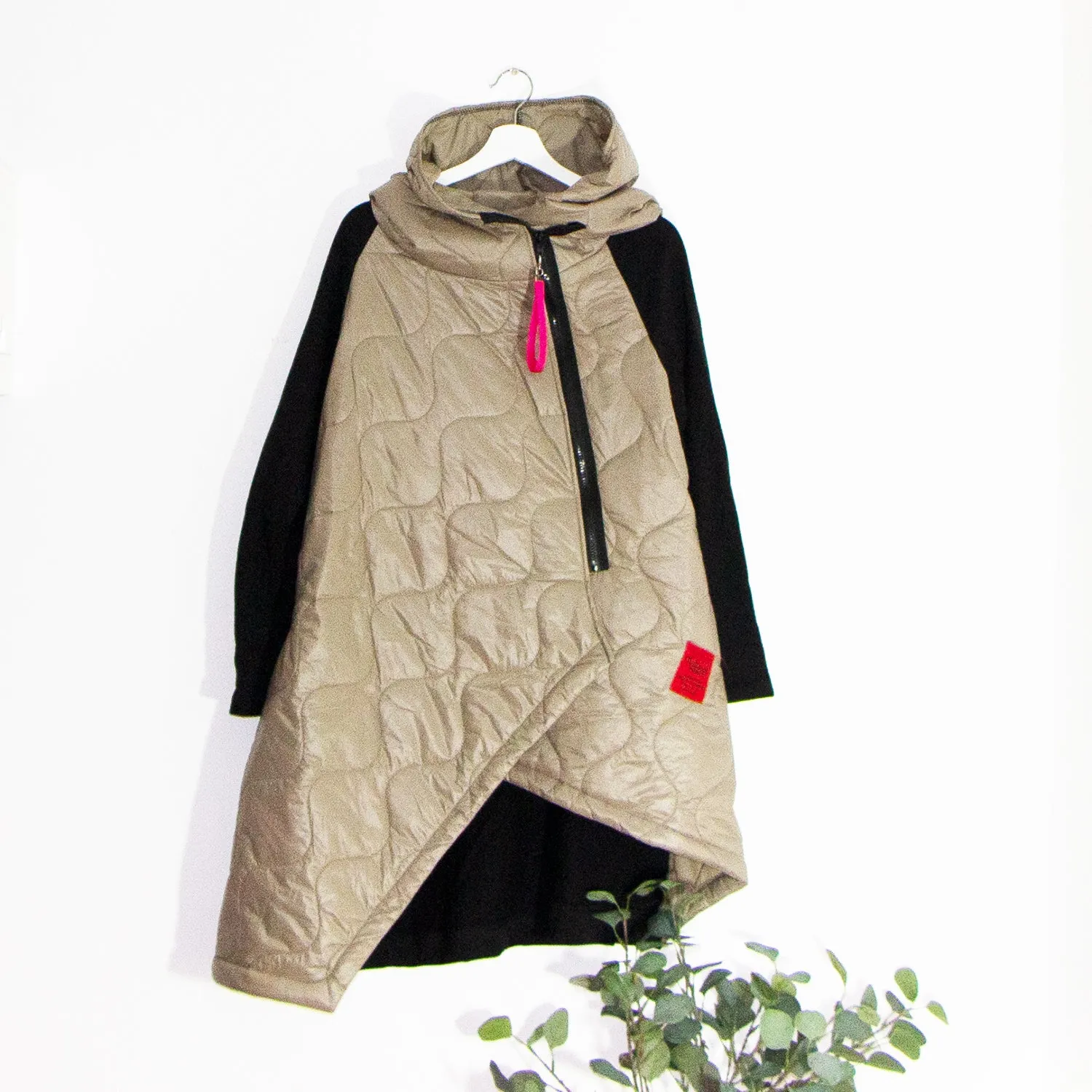 Edgy long puffa parka jacket with hood and drawstring and red zip and patch elements
