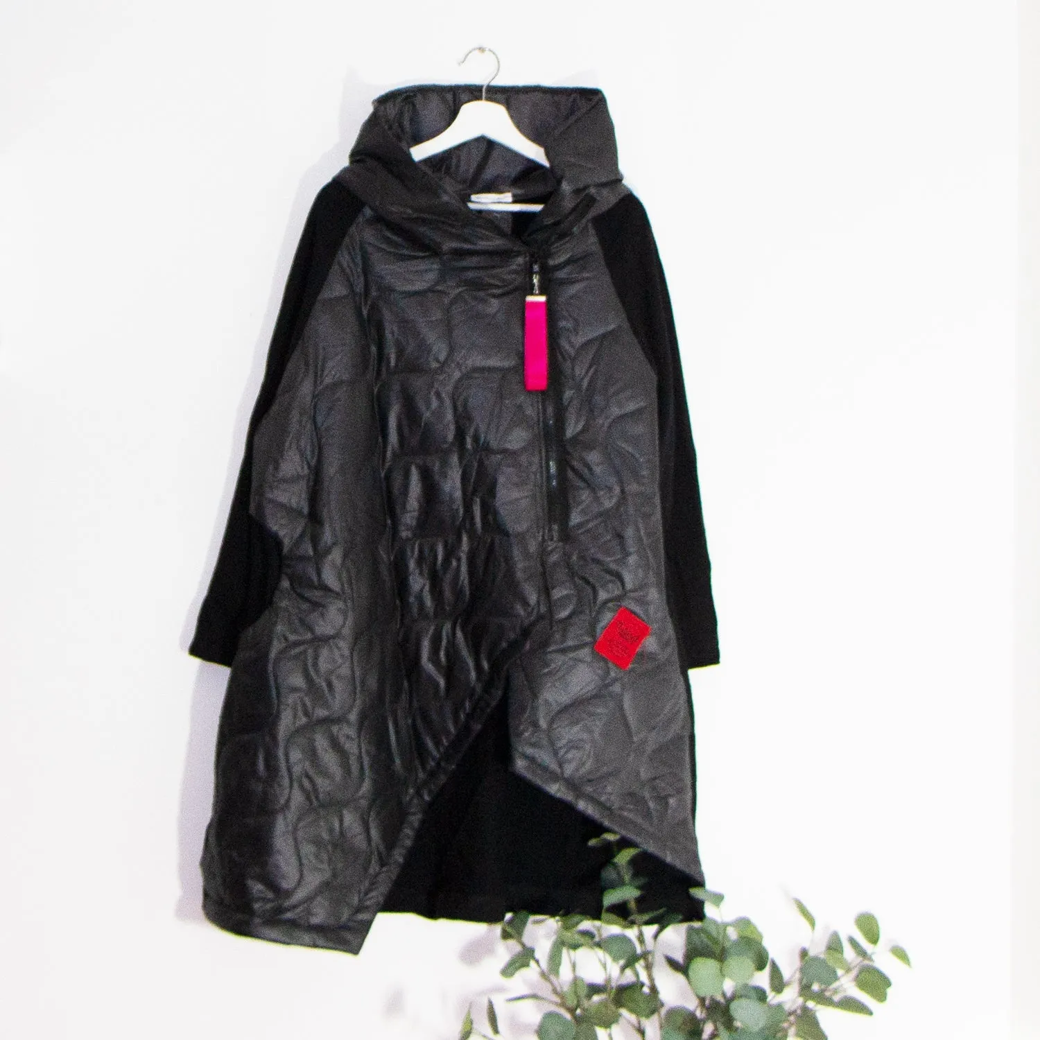 Edgy long puffa parka jacket with hood and drawstring and red zip and patch elements