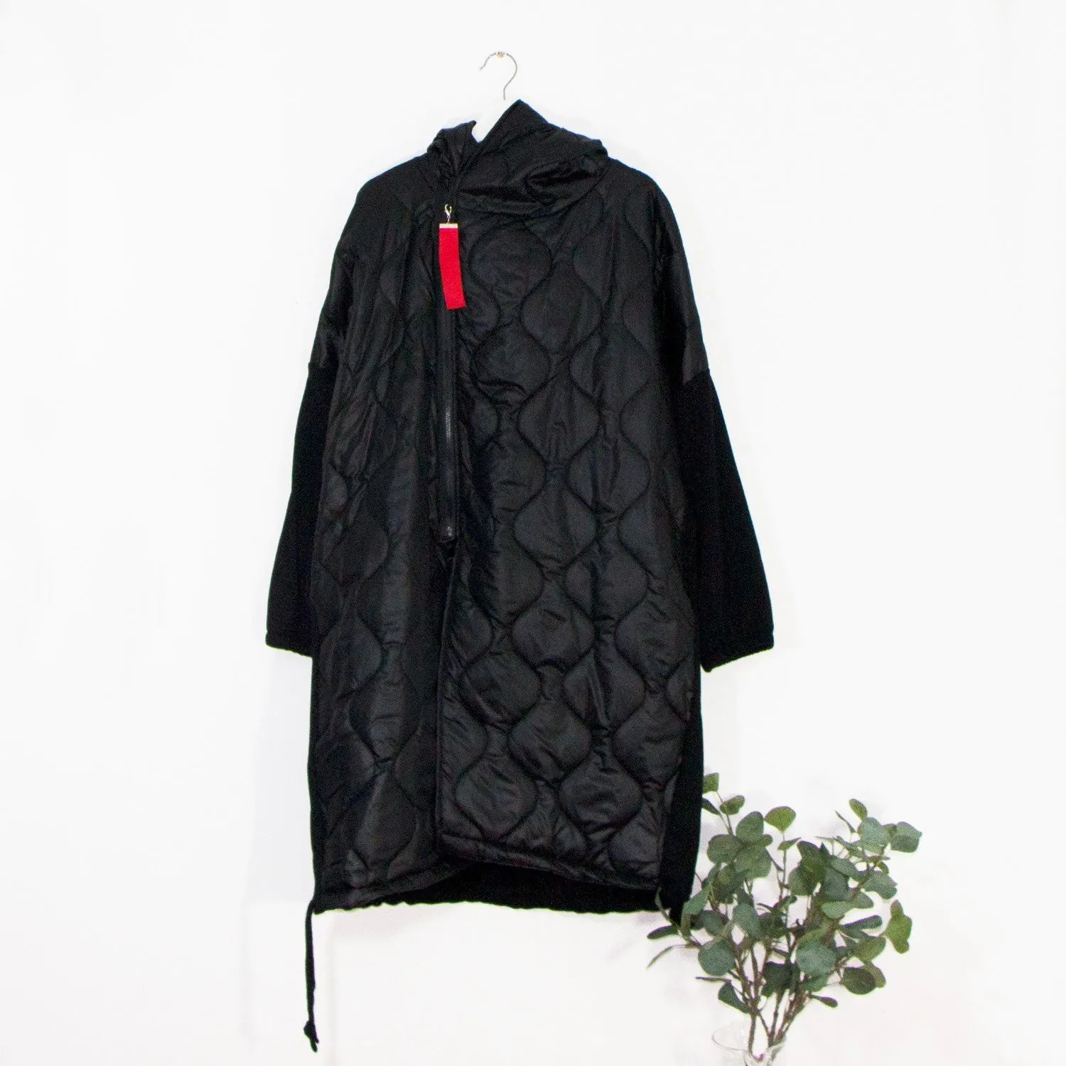 Edgy long puffa parka jacket with hood and drawstring and red zip and patch elements