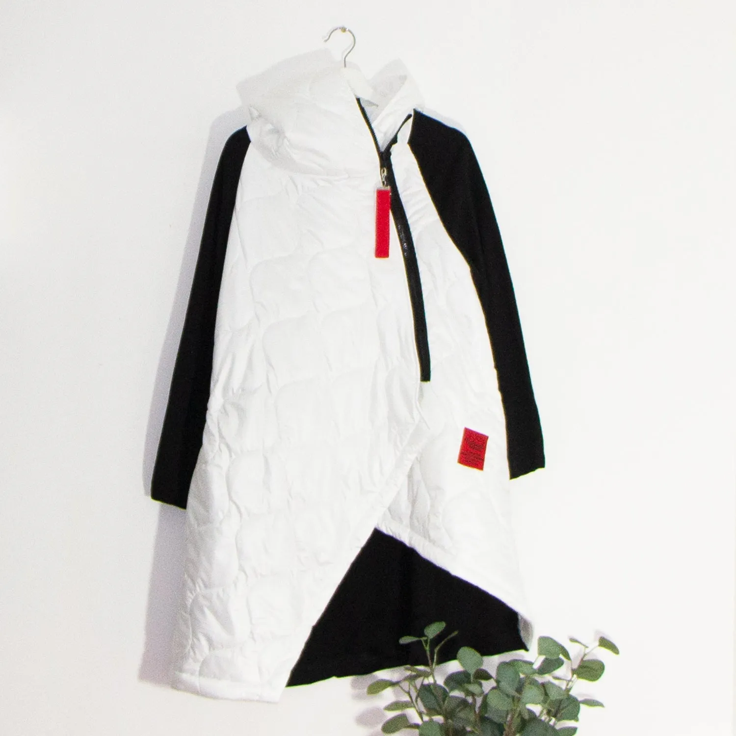 Edgy long puffa parka jacket with hood and drawstring and red zip and patch elements